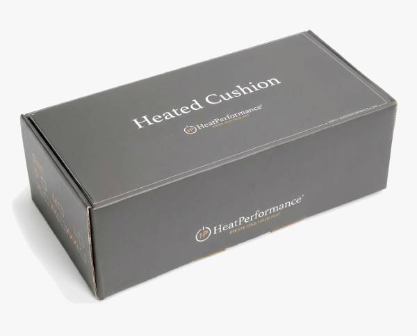 Bewaardoos verwarmd zitkussen op witte achtergrond.